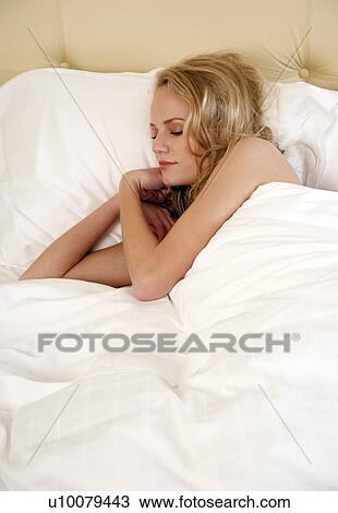 Woman sleeping in bed View Large Photo Image Stock Image - Woman sleeping in bed. Fotosearch
