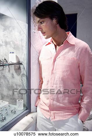 Young man window shopping for jewelry View Large Photo Image Stock Photography - Young man window shopping for jewelry. Fotosearch