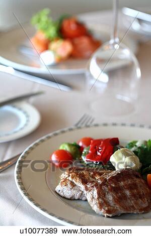 Meat dish on dinner table View Large Photo Image Stock Photo - Meat dish on dinner table. Fotosearch