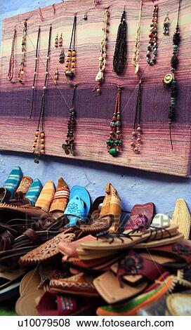 Stock Photo - Moroccan slippers and necklaces for sale. Fotosearch