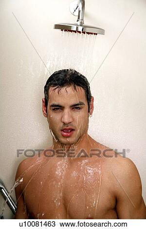 Stock Image - Man taking a shower at the gym. Fotosearch
