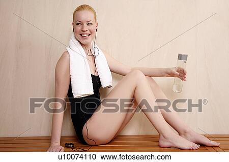 Woman relaxing in locker room after the gym View Large Photo Image Stock Image - Woman relaxing in locker room after the gym. Fotosearch