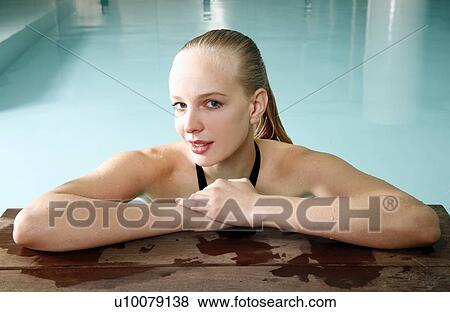 Young woman in a swimming pool at a spa View Large Photo Image Stock Photo - Young woman in a swimming pool at a spa. Fotosearch