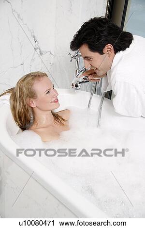 Couple enjoying bubble bath together View Large Photo Image Stock Image - Couple enjoying bubble bath together. Fotosearch