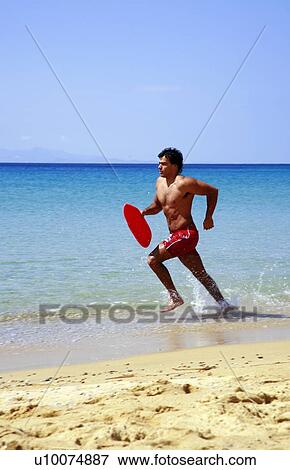 Man splashing through water View Large Photo Image Stock Photo - Man splashing through water. Fotosearch