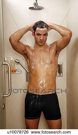 Man taking a shower at the gym View Large Photo Image Stock Photograph - Man taking a shower at the gym. Fotosearch