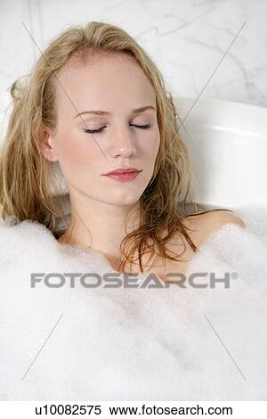 Woman enjoying bubble bath View Large Photo Image Stock Photography - Woman enjoying bubble bath. Fotosearch