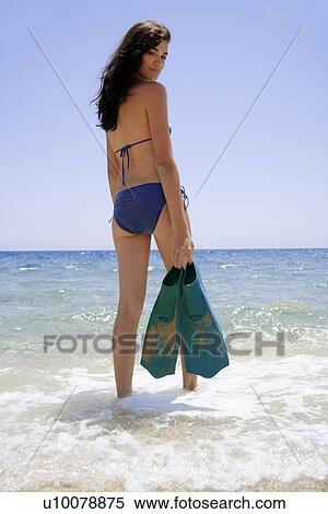 Woman entering water with flippers View Large Photo Image Stock Photography - Woman entering water with flippers. Fotosearch