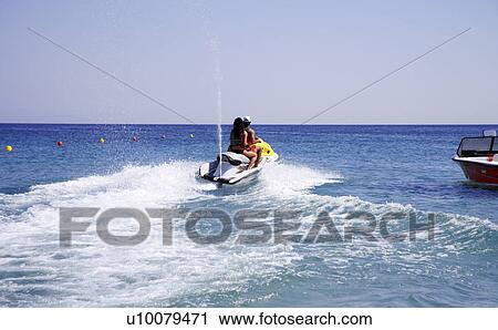 Young couple on jetski View Large Photo Image Stock Image - Young couple on jetski. Fotosearch
