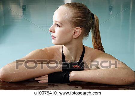 Young woman in a swimming pool at a spa View Large Photo Image Stock Image - Young woman in a swimming pool at a spa. Fotosearch