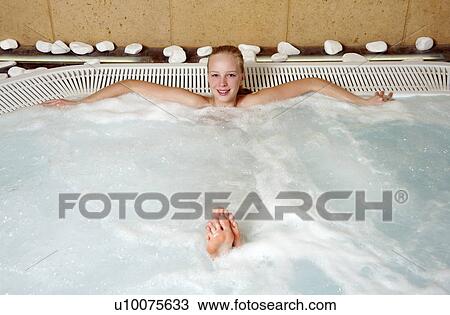Young woman in jacuzzi at a spa View Large Photo Image Stock Image - Young woman in jacuzzi at a spa. Fotosearch