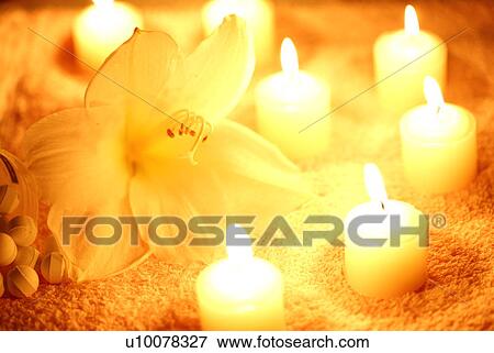 Stock Photo - Flower with lit candles. Fotosearch