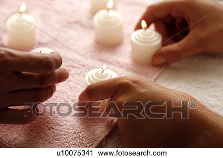 Hands with lit candles View Large Photo Image Stock Image - Hands with lit candles. Fotosearch