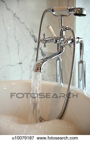 Water running into bathtub View Large Photo Image Stock Photo - Water running into bathtub. Fotosearch