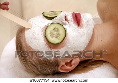 Woman having a facial treatment in a spa View Large Photo Image Picture - Woman having a facial treatment in a spa. Fotosearch