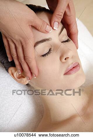 Picture - Woman having facial massage. Fotosearch