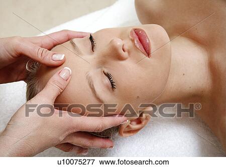 Stock Photo - Woman having facial massage. Fotosearch