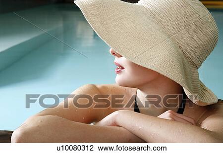 Young woman in a swimming pool at a spa View Large Photo Image Stock Image - Young woman in a swimming pool at a spa. Fotosearch