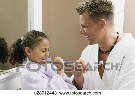Caucasian dad and Mulatto girl (6 years old) brushing their teeth. View Large Photo Image Stock Image - Caucasian dad and Mulatto girl (6 years old) brushing their teeth.. Fotosearch