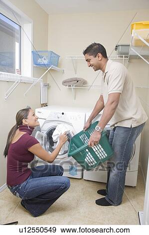 Couple loading cloth diapers into front loading washing machine, Winnipeg, Canada View Large Photo Image Stock Photo - Couple loading cloth diapers into front loading washing machine, Winnipeg, Canada. Fotosearch