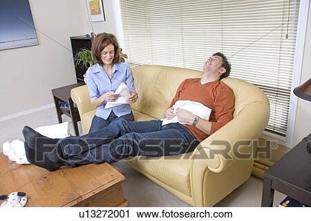 Stock Image - Man and woman folding cloth diapers, Winnipeg, Canada. Fotosearch