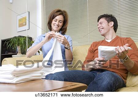 Man and woman folding cloth diapers, Winnipeg, Canada View Large Photo Image Stock Image - Man and woman folding cloth diapers, Winnipeg, Canada. Fotosearch