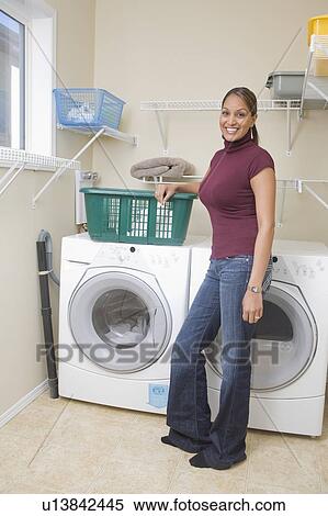 Woman stands beside energy and water efficient front loading washing machine, Winnipeg, Canada View Large Photo Image Stock Photography - Woman stands beside energy and water efficient front loading washing machine, Winnipeg, Canada. Fotosearch