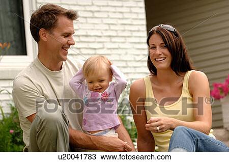 Young couple w/baby in front of house, Regina, Saskatchewan View Large Photo Image Stock Image - Young couple w/baby in front of house, Regina, Saskatchewan. Fotosearch