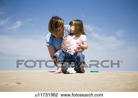 Woman and girl (4) look at ladybugs in collecting jar, Grand Beach Provincial Park, Manitoba, Canada View Large Photo Image Stock Image - Woman and girl (4) look at ladybugs in collecting jar, Grand Beach Provincial Park, Manitoba, Canada. Fotosearch