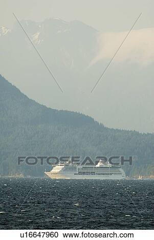 A Cruise ship passing below a large mountain; Canada, British Columbia, Nanaimo View Large Photo Image Stock Image - A Cruise ship passing below a large mountain; Canada, British Columbia, Nanaimo. Fotosearch