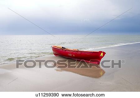 Stock Image - Boat at the seashore, Baltic Sea. Fotosearch