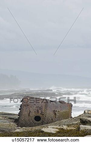 Stock Photo - Rusty Steamship Boiler that has been in this place since the ship wrecked in 1898, Pacific Rim National Park, B. C.. Fotosearch