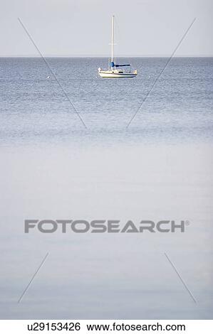 Stock Photograph - Sailboat on Lake Manitoba, Canada. Fotosearch