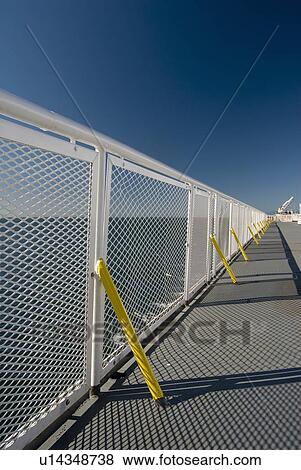 Stock Photo - White railing and blue sky of a ferry boat, BC Ferries, Nanaimo, BC, Canada. Fotosearch