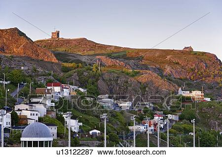 View of The Battery and Cabot Tower (Signal Hill National Historic Site) at sunset, St. John's, Newfoundland, Canada View Large Photo Image Stock Photo - View of The Battery and Cabot Tower (Signal Hill National Historic Site) at sunset, St. John's, Newfoundland, Canada. Fotosearch