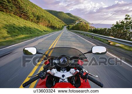 Picture - View on Motorcycle in action on Cabot Trail, Cape Breton Highlands National Park, Nova Scotia, Canada. Fotosearch