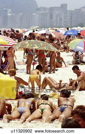 Crowded Copa Cabana beach area with three women in foreground View Large Photo Image Stock Image - Crowded Copa Cabana beach area with three women in foreground. Fotosearch