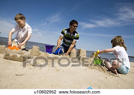 Family building sand castles, Grand Beach Provincial Park, Manitoba, Canada View Large Photo Image Stock Image - Family building sand castles, Grand Beach Provincial Park, Manitoba, Canada. Fotosearch