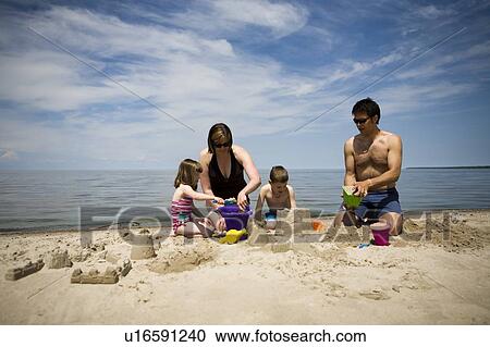 Family in bathing suits making sand castles, Grand Beach provincial Park, Manitoba, Canada View Large Photo Image Stock Image - Family in bathing suits making sand castles, Grand Beach provincial Park, Manitoba, Canada. Fotosearch