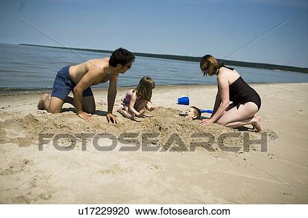 Family in bathing suits making sand castles, Grand Beach provincial Park, Manitoba, Canada View Large Photo Image Stock Image - Family in bathing suits making sand castles, Grand Beach provincial Park, Manitoba, Canada. Fotosearch