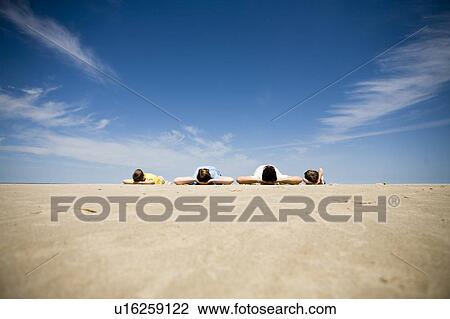 Family of four lying on beach, Grand Beach Provincial Park, Manitoba, Canada View Large Photo Image Stock Image - Family of four lying on beach, Grand Beach Provincial Park, Manitoba, Canada. Fotosearch