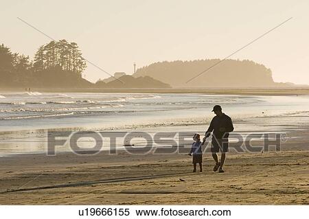 Father & daughter walk along beach, Chesterman Beach near Tofino, Vancouver Island, British Columbia, Canada View Large Photo Image Stock Photography - Father & daughter walk along beach, Chesterman Beach near Tofino, Vancouver Island, British Columbia, Canada. Fotosearch