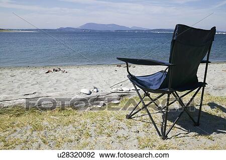 Foldable chair on the beach at Sidney Spit Marine Park, BC, Canada View Large Photo Image Stock Image - Foldable chair on the beach at Sidney Spit Marine Park, BC, Canada. Fotosearch