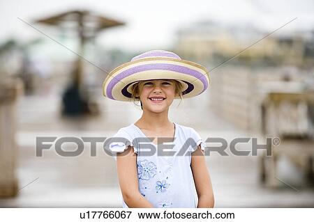 Stock Photo - Girl - (5) with beach hat, Jacksonville, Florida. Fotosearch