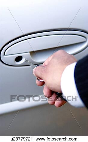 Businessman locking or unlocking car door View Large Photo Image Stock Image - Businessman locking or unlocking car door. Fotosearch
