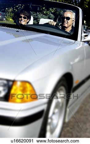 Couple in convertible View Large Photo Image Stock Image - Couple in convertible. Fotosearch