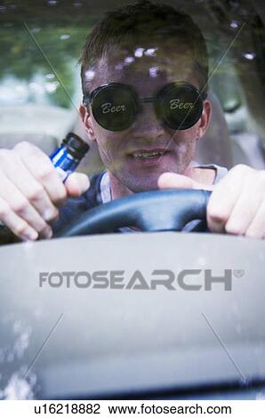 Man driving drunk View Large Photo Image Stock Image - Man driving drunk. Fotosearch