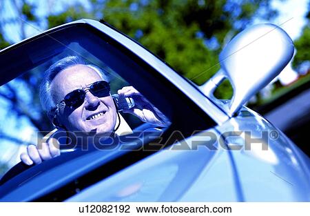 Man in convertible View Large Photo Image Stock Image - Man in convertible. Fotosearch
