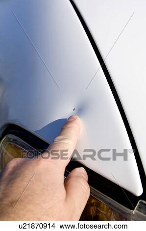 Person pointing at dent on front fender View Large Photo Image Picture - Person pointing at dent on front fender. Fotosearch