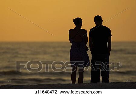 Couple at on the beach View Large Photo Image Stock Image - Couple at on the beach. Fotosearch